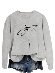 Detail of grey crewneck sweatshirt with dragonfly print and ribbed cuffs and hemline