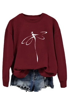 Detail of burgundy crewneck sweatshirt featuring a white minimalist dragonfly art print