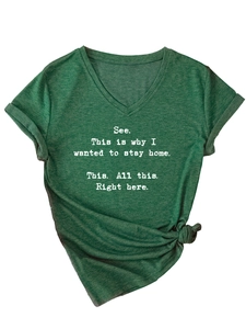 Close-up of heather green V-neck T-shirt with white printed quote and knot detail