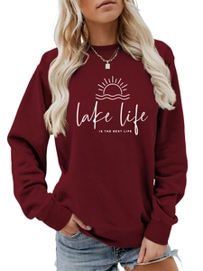 Detail of burgundy lake life crewneck sweatshirt showing white graphic and ribbed neckline