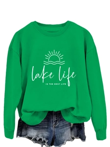 Close-up of grass green sweatshirt with lake life is the best life printed graphic