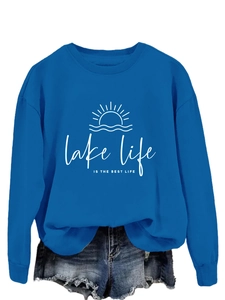 Detail of blue Lake Life Is The Best Life sweatshirt with distressed denim shorts