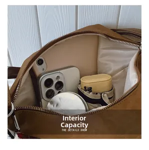Detailed interior view of a large brown leather tote showing spacious multi-pocket storage
