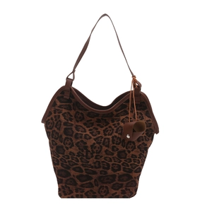 Large leopard print tote bag with brown leather straps on a white background