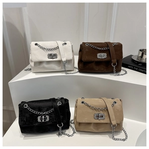 Group shot of four suede chain bags with diamond buckles in white, brown, black and khaki