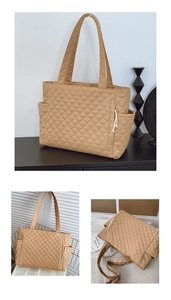 Detailed view of khaki quilted tote bag with side pockets and diamond stitch pattern