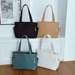 Minimalist quilted rhombic tote bags in multiple colors with side pockets and long straps