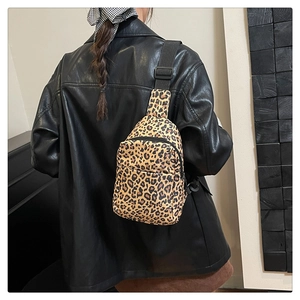 Leopard print chest bag detail featuring durable nylon fabric and adjustable wide strap