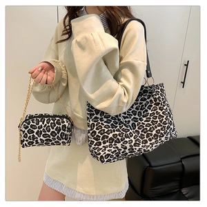 Detail showing leopard print tote bag and small chain crossbody pouch set for women