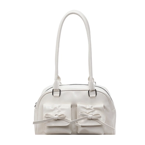 White faux leather ballet-style shoulder bag with decorative bows and twin pockets