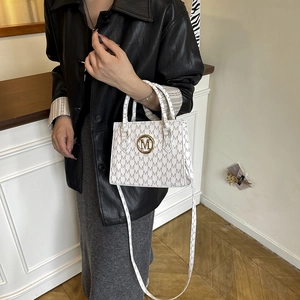 White faux leather shoulder bag with grey M monogram pattern and golden metal logo