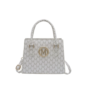 White leather tote bag with gray M-letter print and golden circular logo emblem