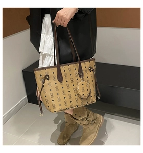 Detail of large tote bag with bear monogram pattern and matching round pouch charm