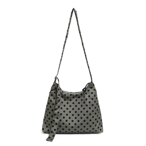 Olive green tote bag with black polka dots made of lightweight nylon fabric