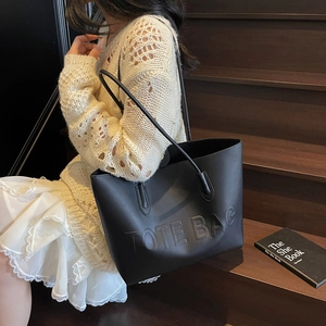 Large black vintage tote bag with embossed lettering for women's autumn fashion