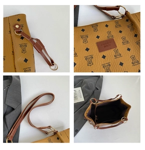 Detail view showing bear pattern print, gold hardware, and large capacity of the tote bag