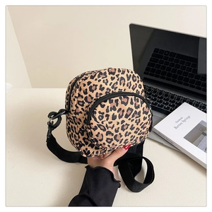 Handheld leopard print crossbody bag with double zippers and black nylon shoulder strap