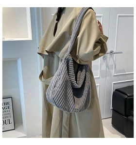 Detail of grey corduroy tote bag showing ribbed texture and casual slouchy hobo style