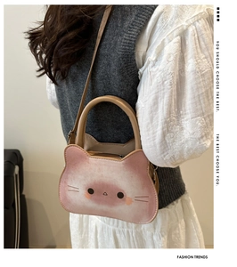Cat-shaped pink gradient crossbody bag shown on model highlighting daily styling and size
