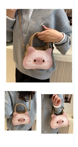 Detailed views of a pink cat-shaped cartoon tote bag with dual handles and crossbody strap