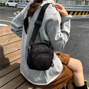 Lightweight waterproof black nylon crossbody bag for women with adjustable strap