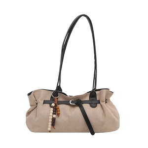 Minimalist beige suede tote bag with vintage wooden beads and black leather straps