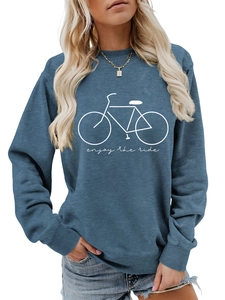 Close-up of fog blue sweatshirt fabric with white bicycle print and enjoy the ride text
