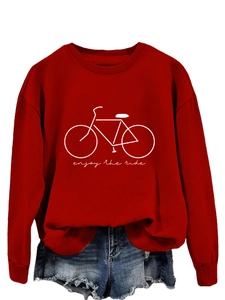 Close-up of red crewneck sweatshirt featuring white bicycle print and enjoy the ride text