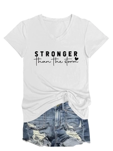 Detail of V-neck white T-shirt with Stronger Than The Storm print and ripped denim shorts