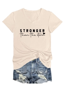 Detail of V-neck T-shirt with Stronger than the Storm print and ripped denim shorts