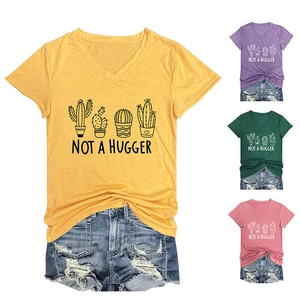 Detail of four colorful V-neck cotton T-shirts with cactus print and Not A Hugger text