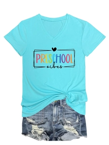 Detail of V-neck blue T-shirt with Preschool Vibes print and stylish side knot design