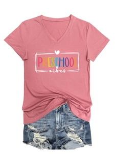 Close-up of Preschool Vibes print on V-neck short sleeve tee and distressed denim shorts