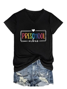 Detail of V-neck black t-shirt with Preschool Vibes print and blue denim shorts