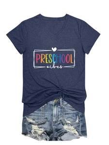 Detail of V-neck preschool vibes T-shirt with knotted hem and distressed denim shorts