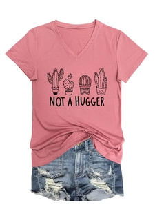 Detailed view of women's V-neck pink T-shirt with cactus print and ripped denim shorts