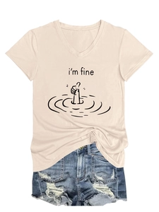 Flat lay of an apricot V-neck T-shirt with I'm Fine graphic and ripped denim shorts
