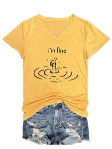 Flat lay of yellow V-neck T-shirt with I'm Fine text and ripped denim shorts