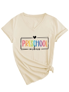 Detail of V-neck beige cotton T-shirt with Preschool Vibes print and knotted hem
