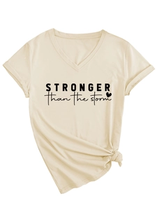 Detail of V-neck T-shirt showing Stronger Than The Storm print and stylish side knot
