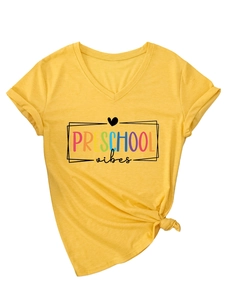 Detail of V-neck mustard t-shirt with Preschool Vibes print and stylish knotted hem