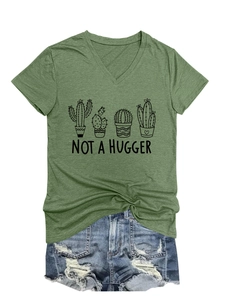Detail view of green V-neck T-shirt featuring Not a Hugger cactus print and denim shorts