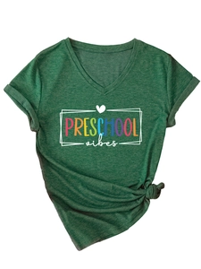Detail of V-neck heather green T-shirt featuring Preschool Vibes print and knot hem design