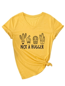 Detail of V-neck T-shirt showing cactus print and stylish knot detail at the hemline