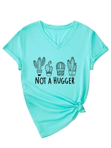 Detail of turquoise V-neck T-shirt with cactus print and stylish knotted hem design