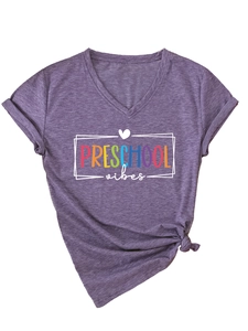 Detail of purple V-neck T-shirt featuring Preschool Vibes print and stylish knot at the hem