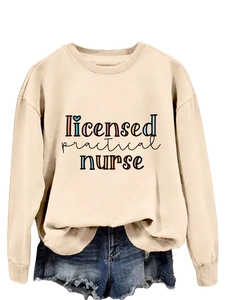 Detail of Licensed Practical Nurse sweatshirt in apricot with ribbed neck and colorful text