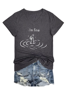 Flat lay of gray V-neck I'm Fine t-shirt paired with distressed blue denim shorts