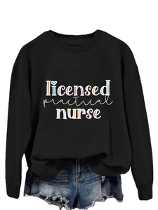 Flat lay of black long sleeve Licensed Practical Nurse sweatshirt with blue denim shorts