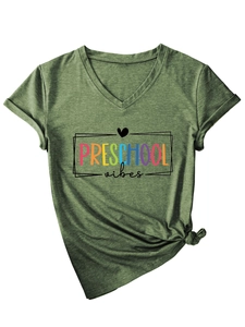 Detail of V-neck green cotton T-shirt with Preschool Vibes print and stylish front knot